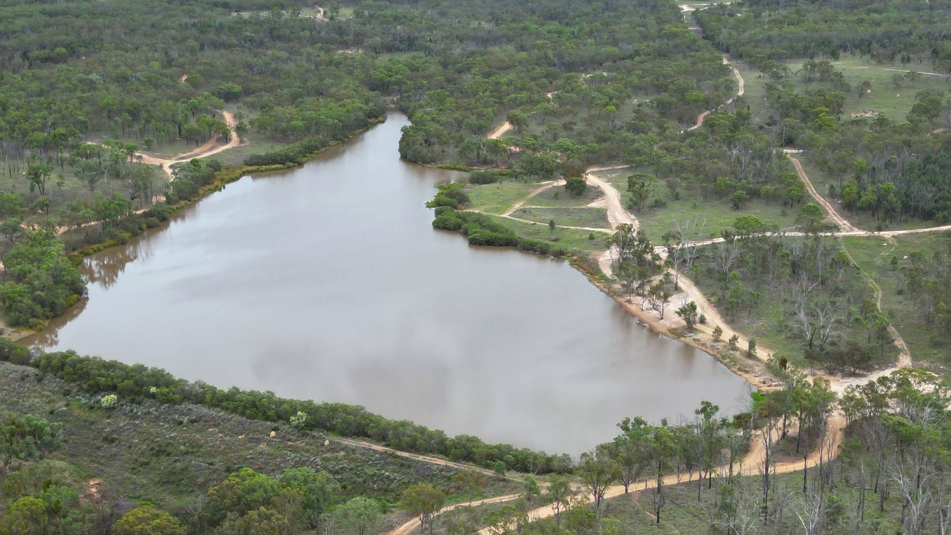 Aerial view of the dam and bushland at Glendon